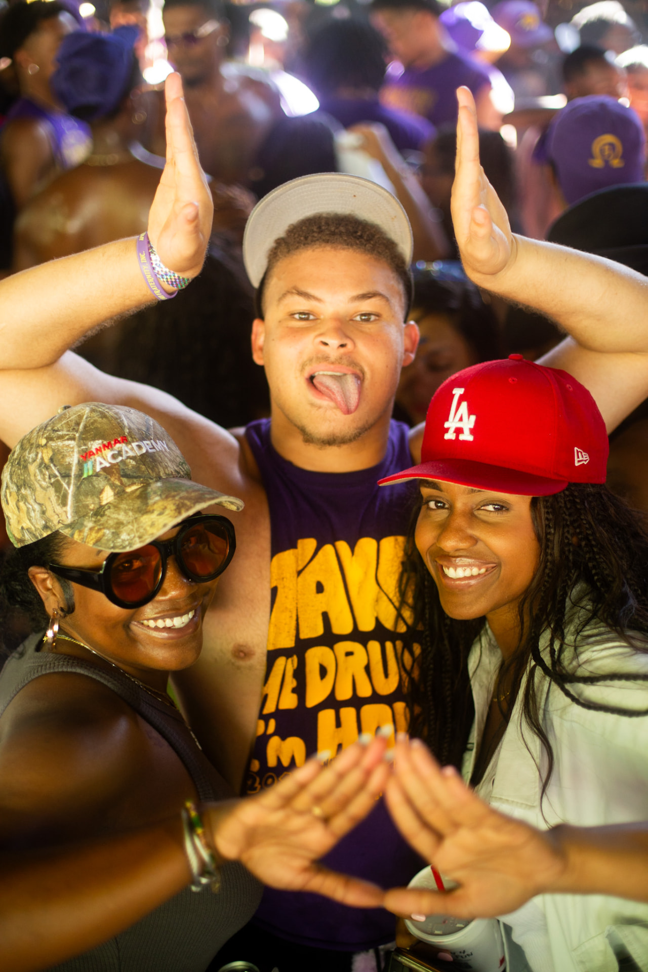Festival crowd — purple and gold repping in the pit