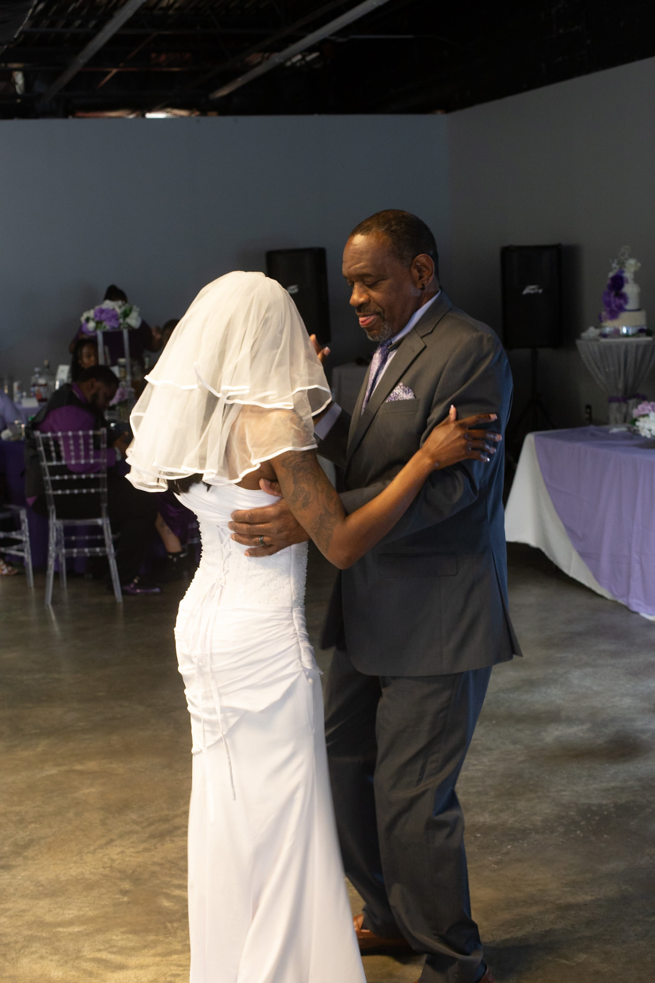 Wedding — bride and her father sharing the first dance in the reception hall