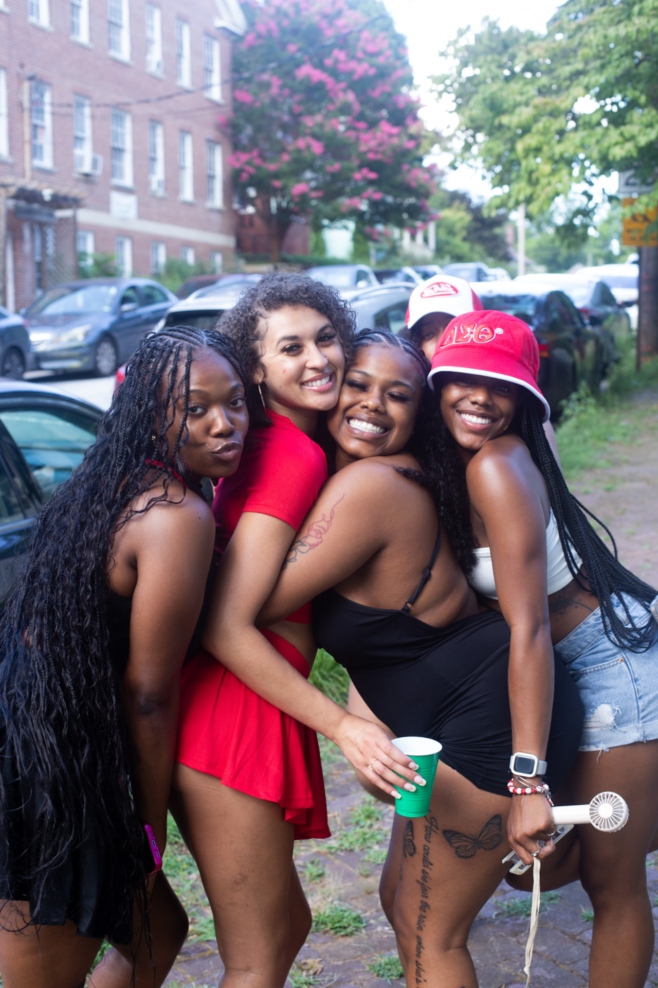 Day party — group of friends hugging it out on the block