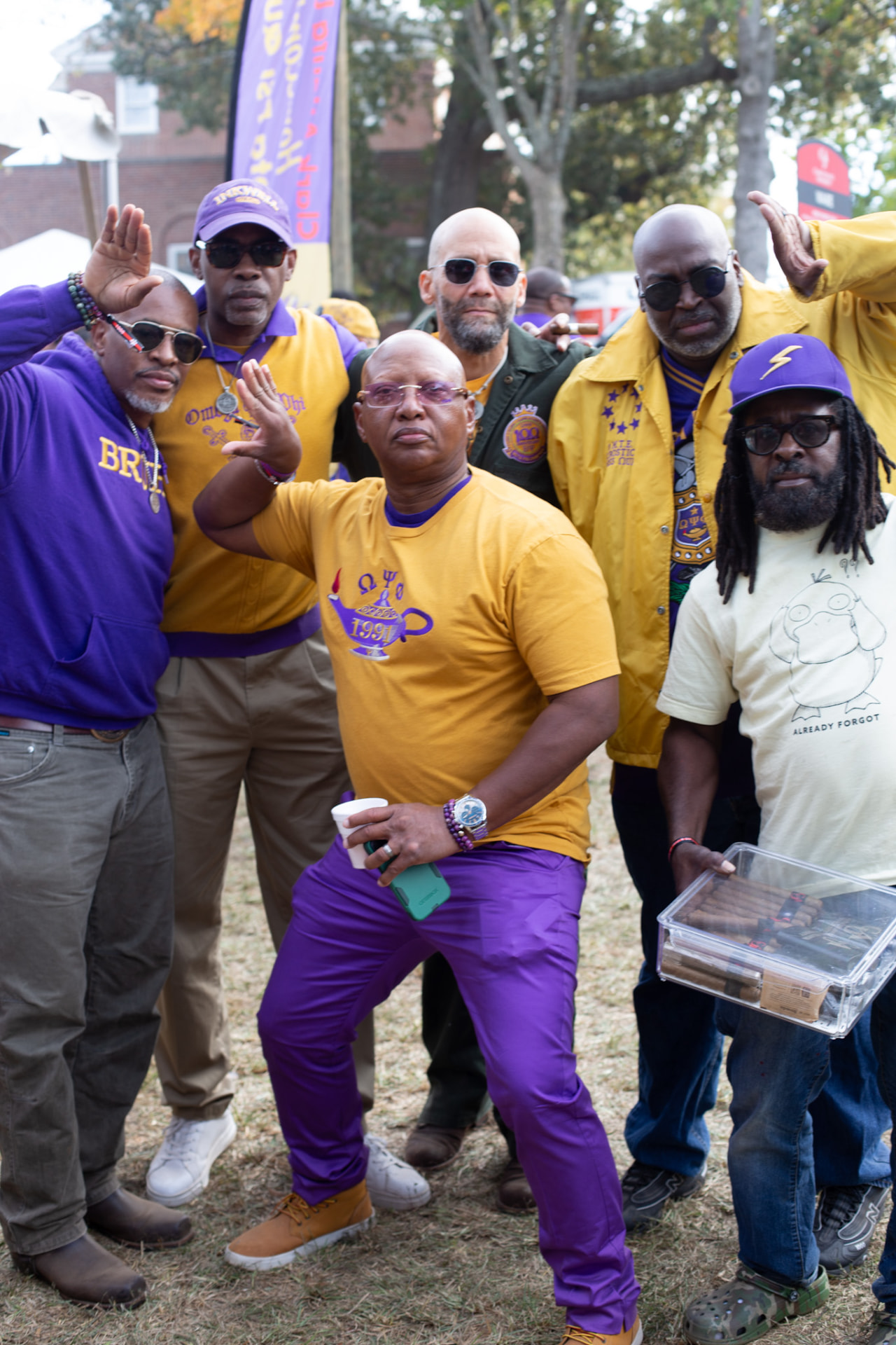 Event photography — the brothers in purple and gold at the picnic