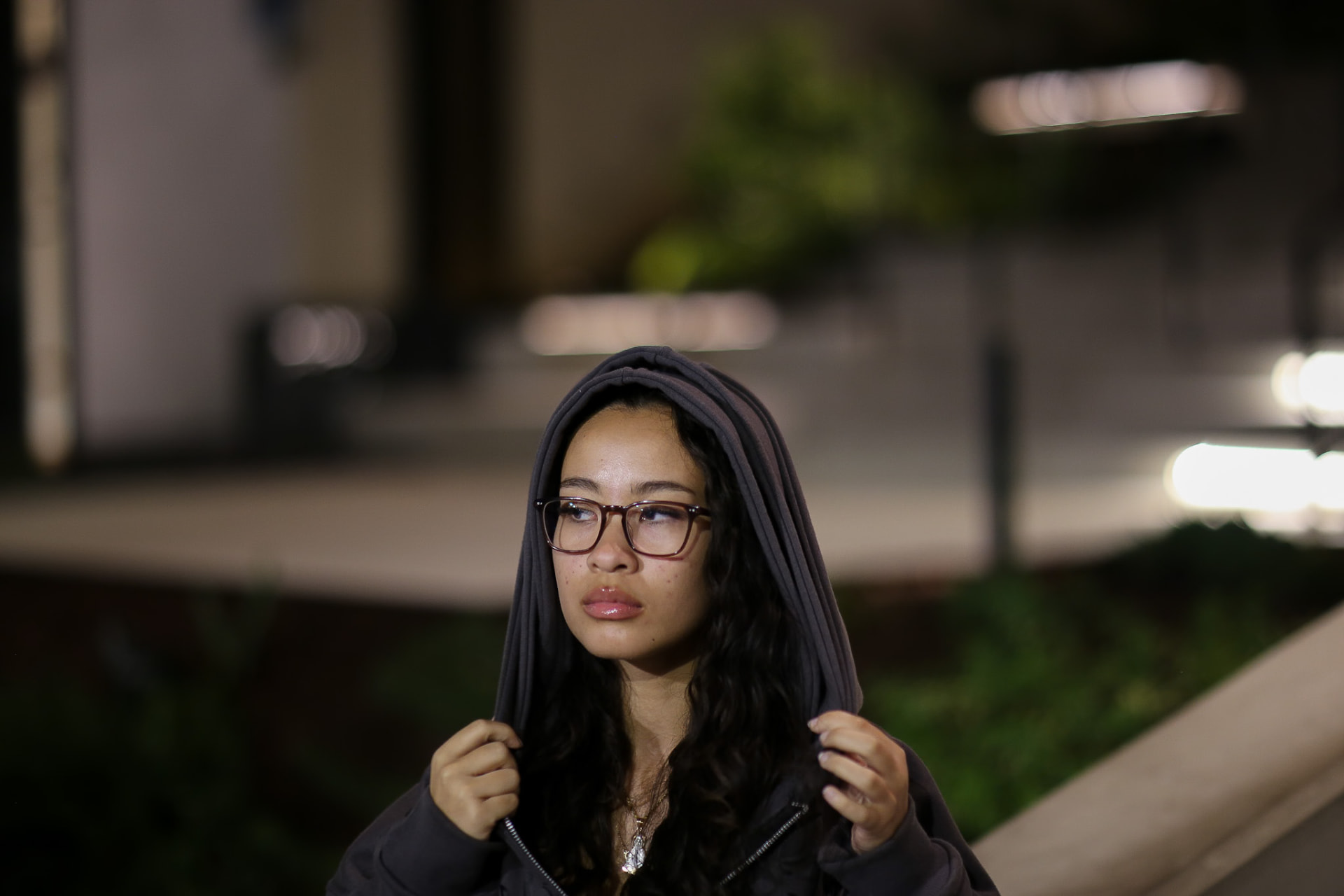 Streetwear brand lookbook — hooded night portrait