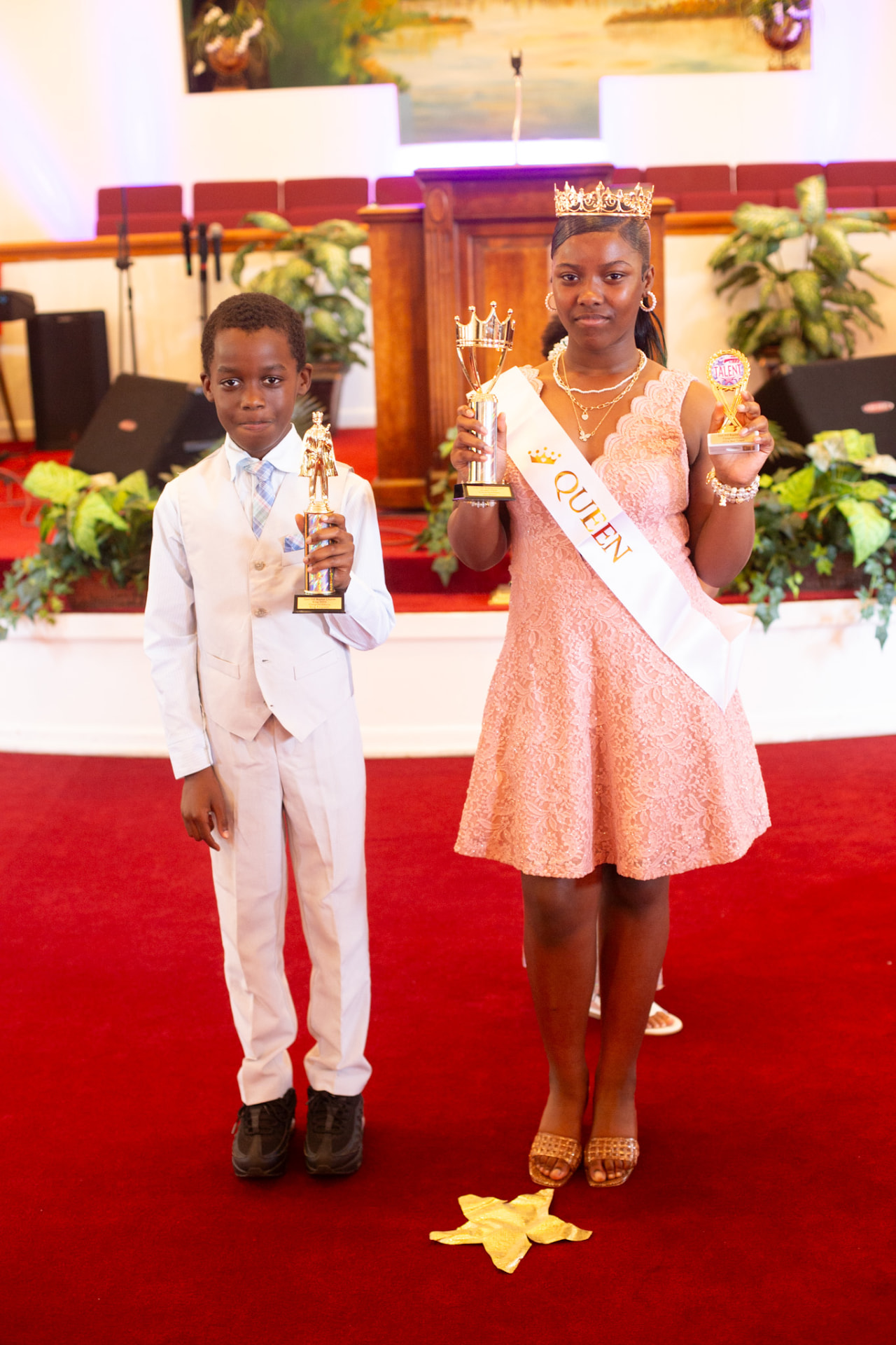 Event photography — pageant queen and king with their trophies