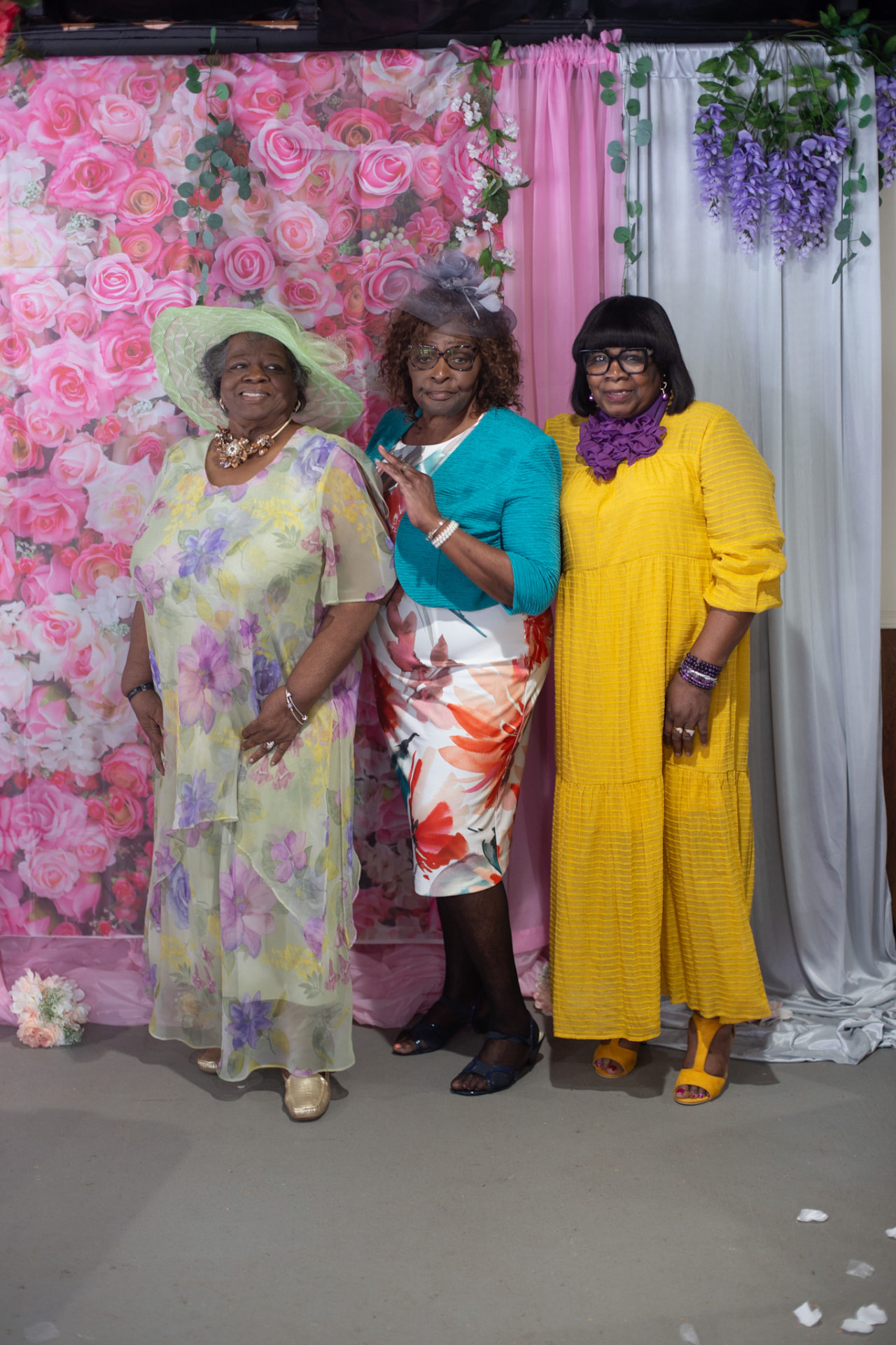 Event photography — three ladies in Sunday best at the garden party