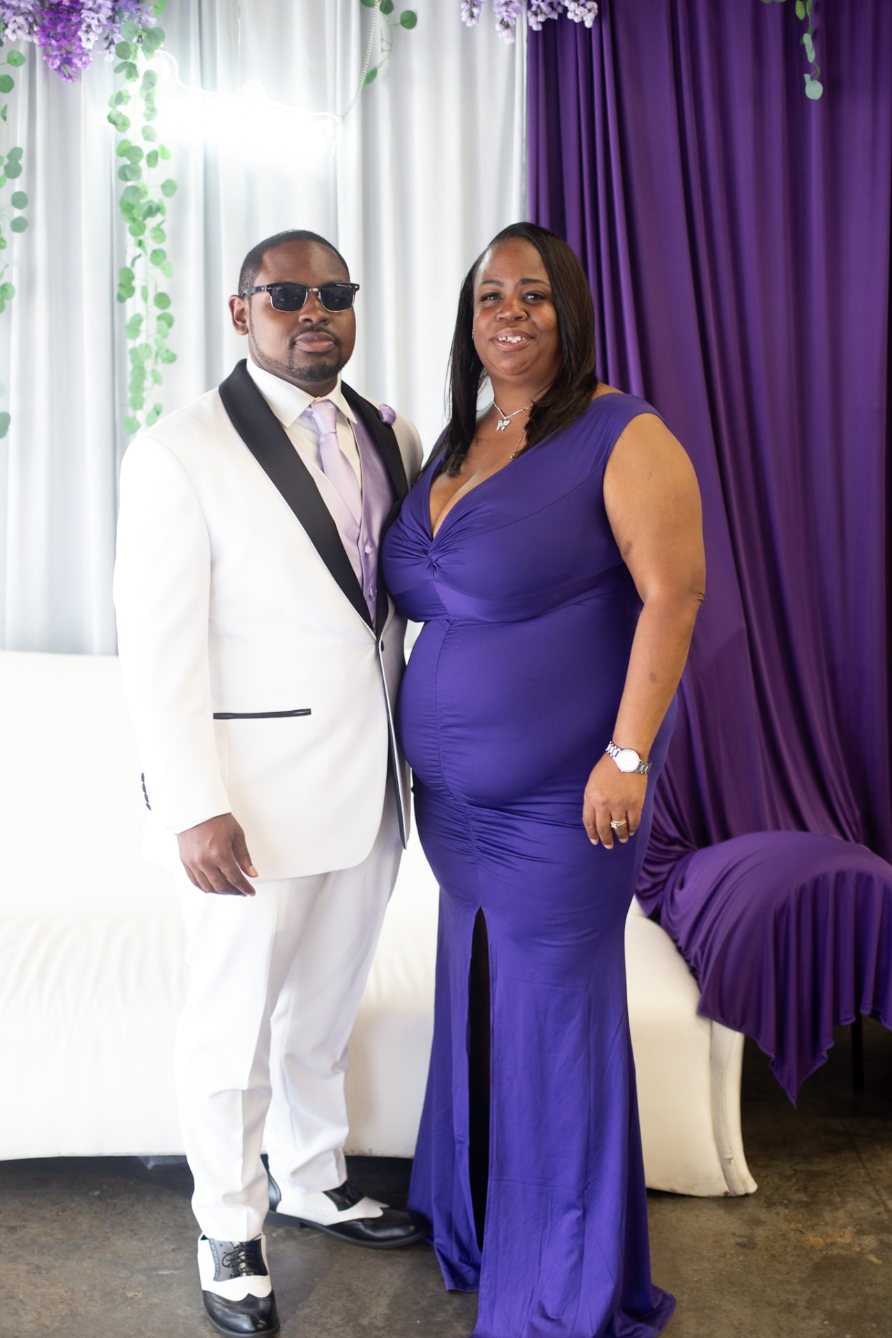 Wedding — groom with his mother in a purple gown against the purple drapes