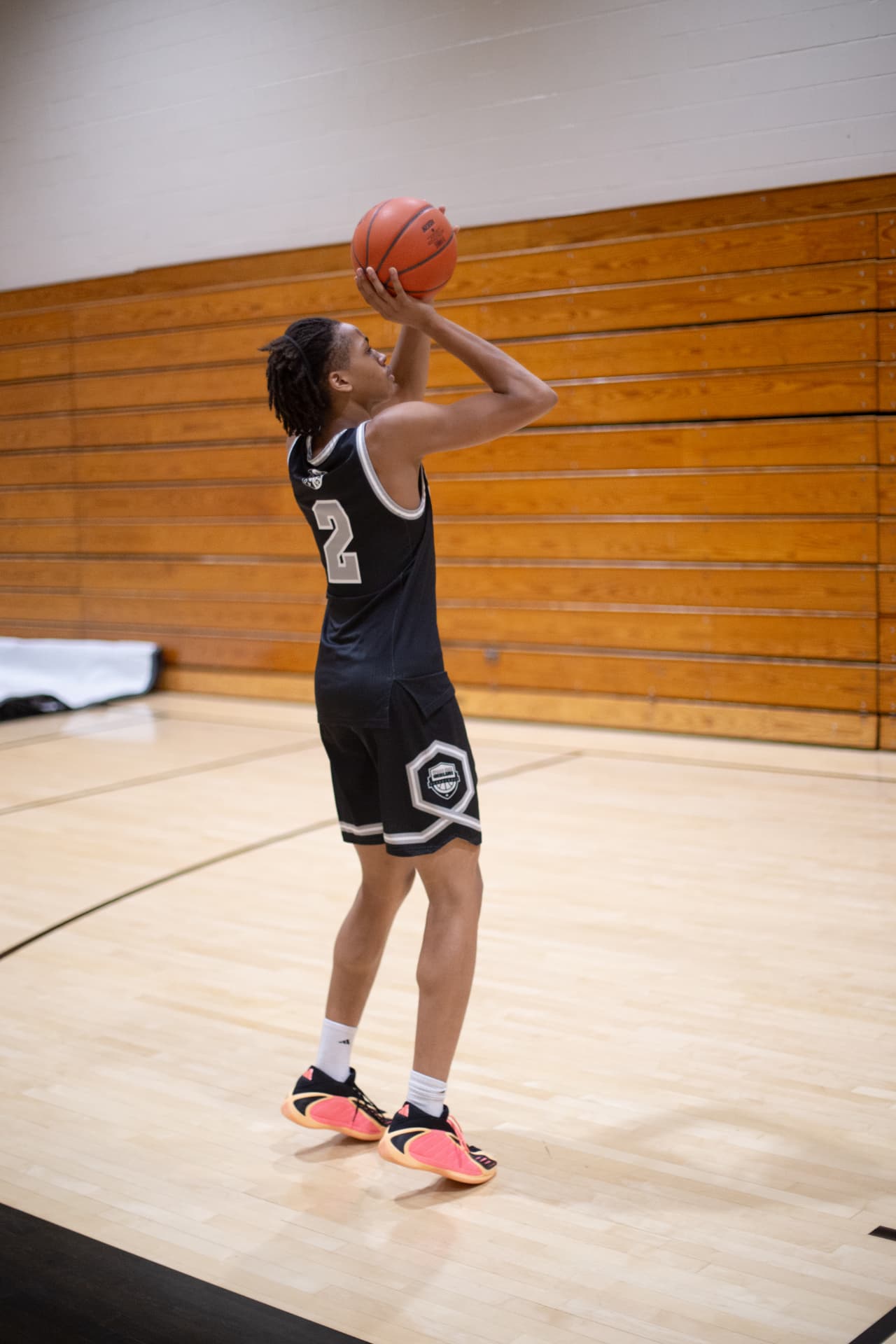 Sports action — number 2 squaring up for the jumper at the free-throw line